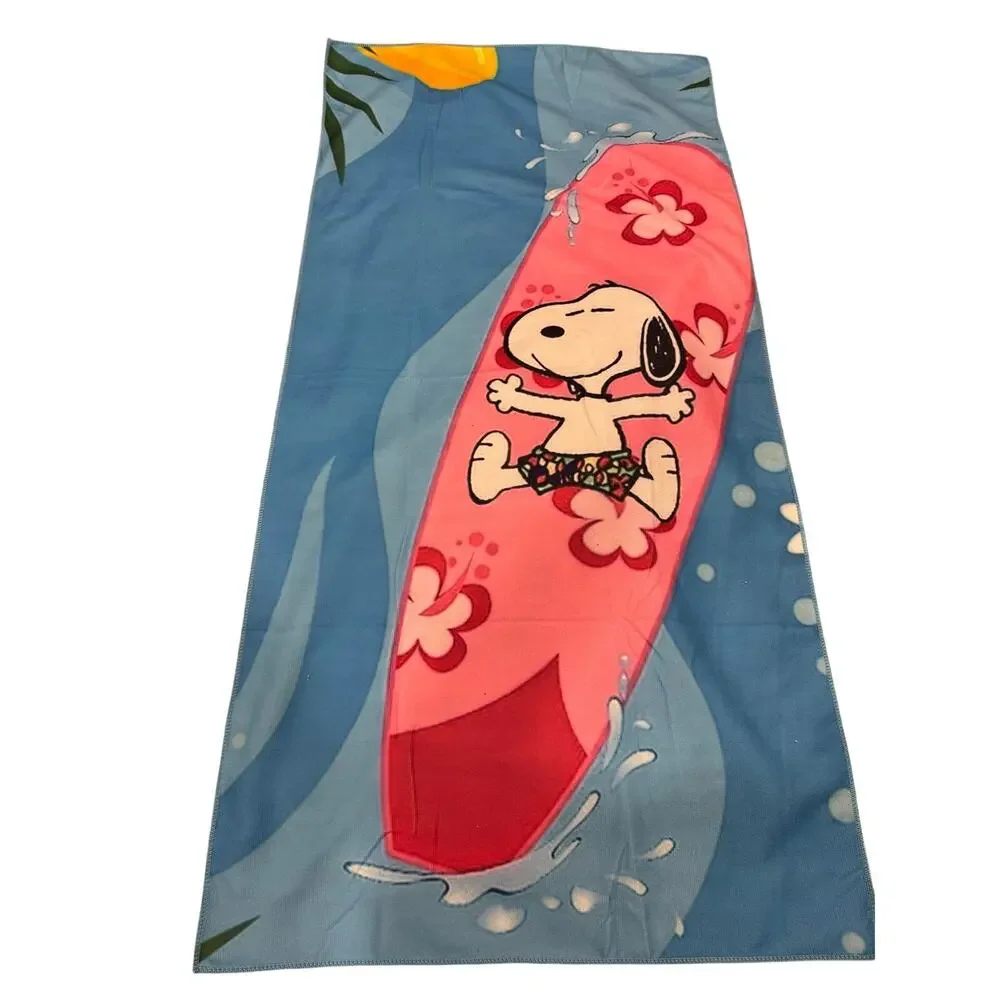 Snoopy on a surfboard beach towel